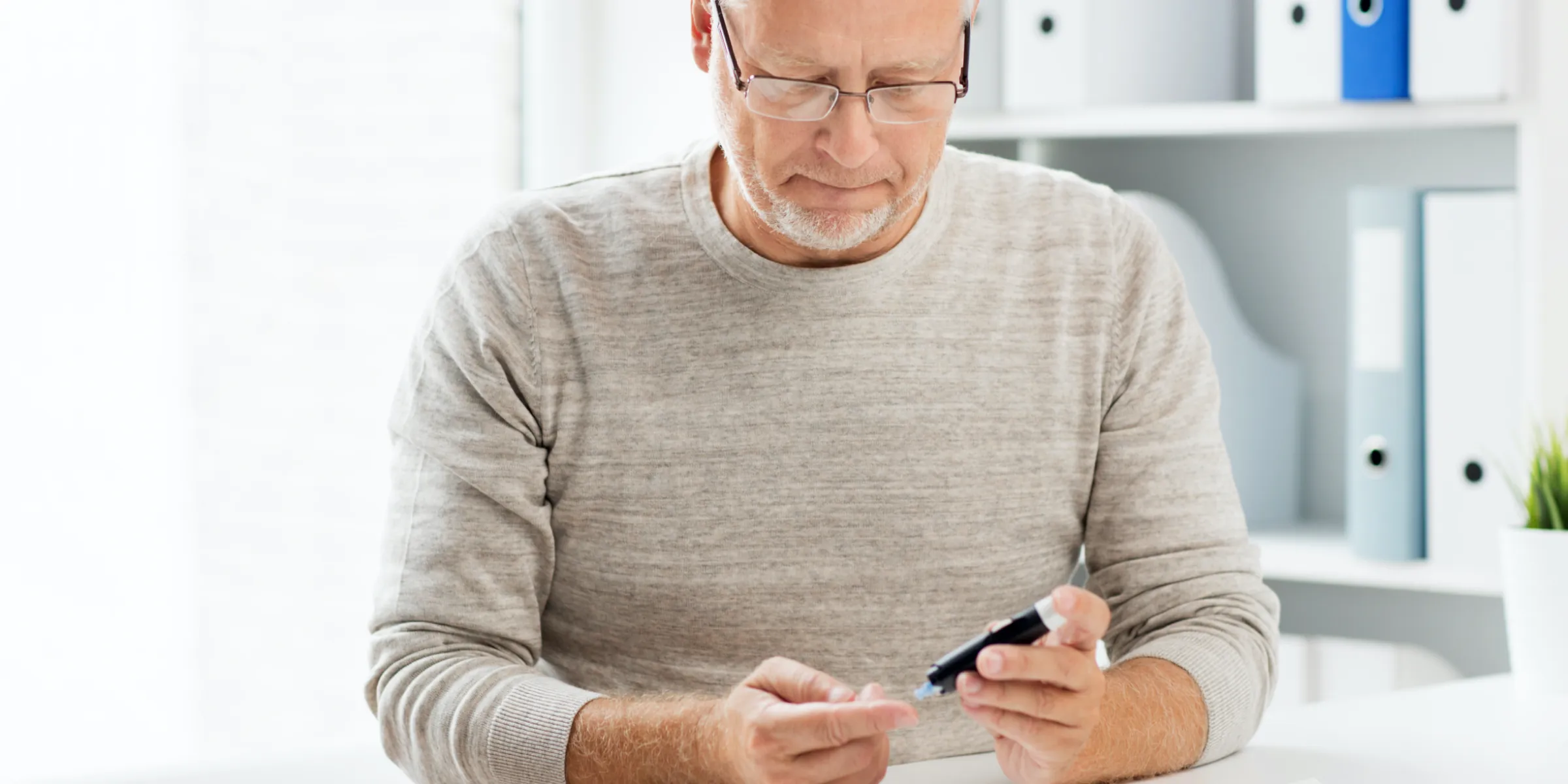 Man checking his blood sugar levels