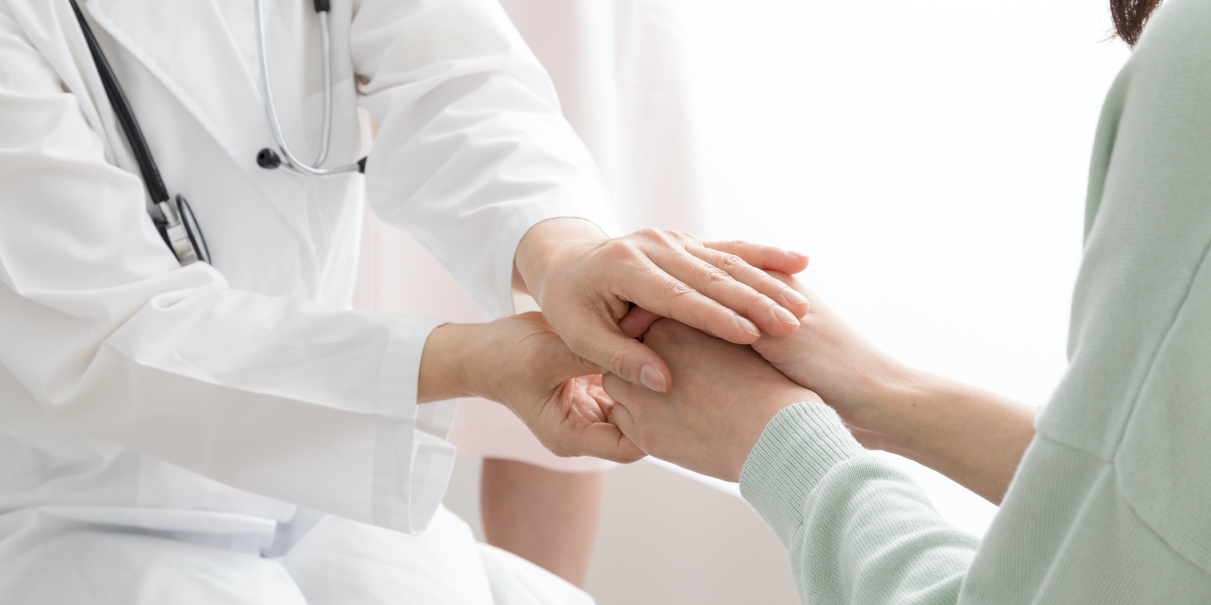 Doctor holding a patient's hands