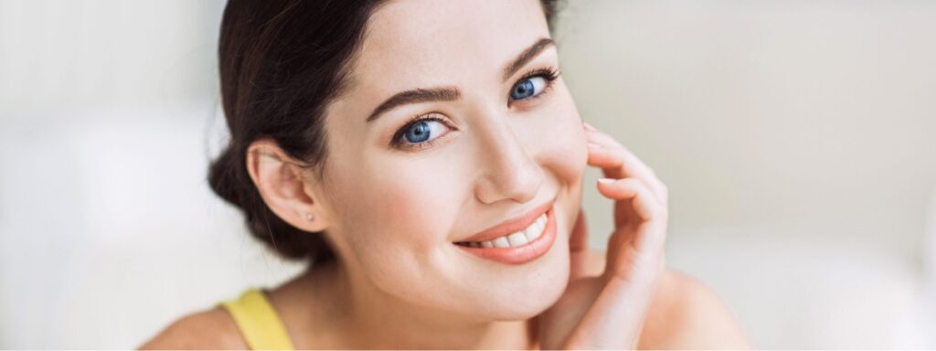 Photo of a woman with dark hair and great skin