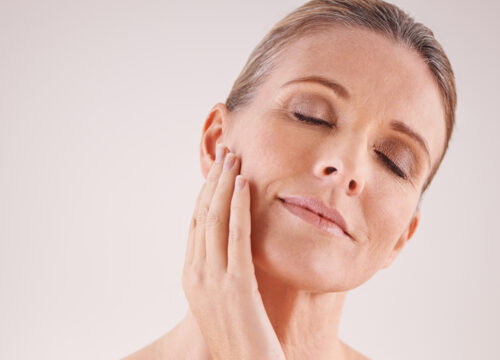 Photo of an older woman with great skin after Sculptra® treatments